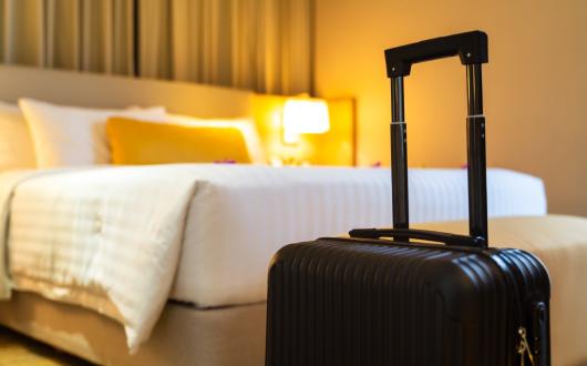 A suitcase delivered to a hotel room