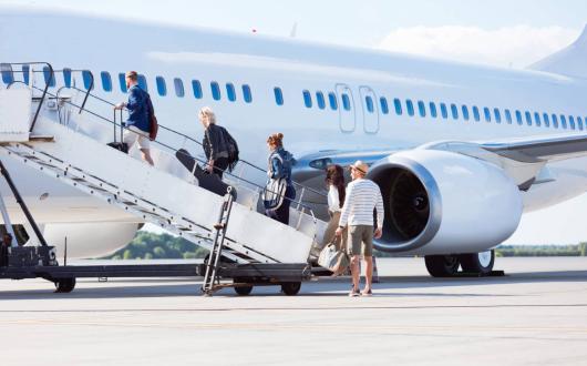 Travellers boarding a plane