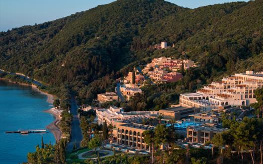 Aerial view of MarBella resort, a hotel sat in a sweeping, tree-covered cove