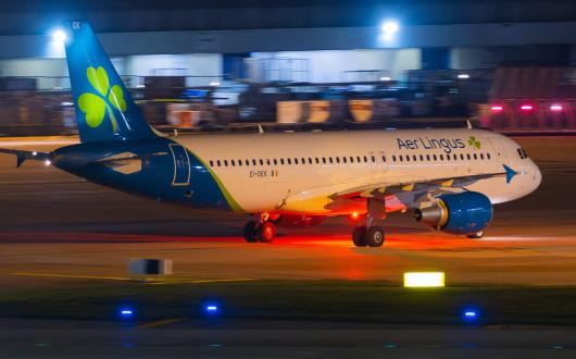 An Aer Lingus aircraft lands at Manchester airport