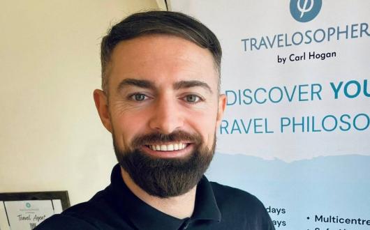 Headshot of Travelosopher travel agent Carl Hogan
