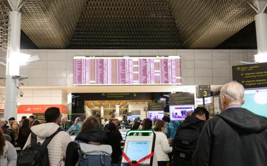 Travellers check in at Lisbon airport