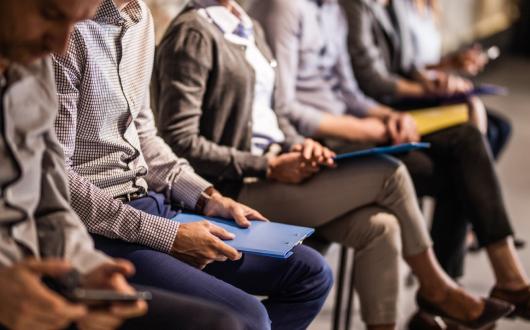 Job candidates wait to be seen for roles