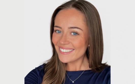 Woman smiling with brown hair 