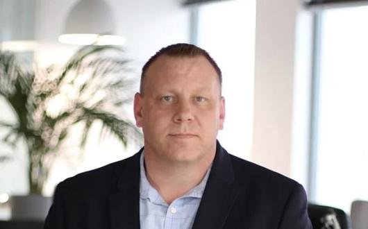 Man in suit headshot 