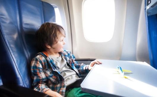 Boy on aircraft (stock)
