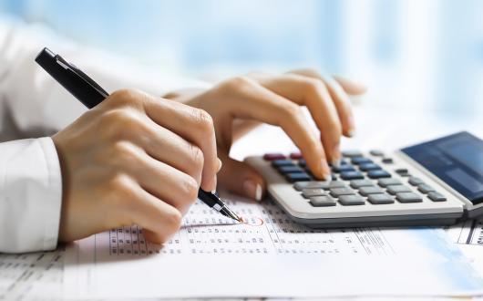 Accountancy - accountant uses calculator