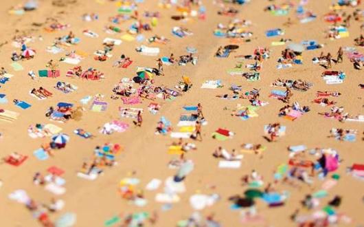 Spain beach sunbathers iStock_13962374