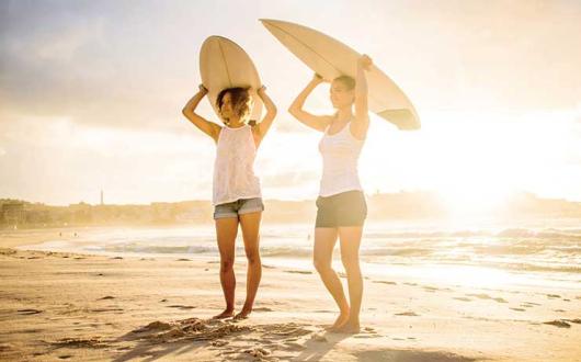 Female surfers on the beach
