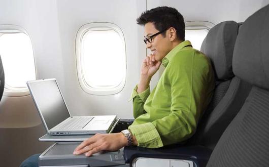 Laptop work on a flight iStock-172898489