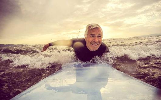 Older man surfing