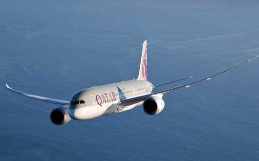 Qatar Airways jet over the ocean