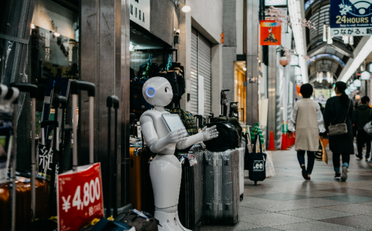 Robot standing by luggage_Photo by Lukas on Unsplash.png