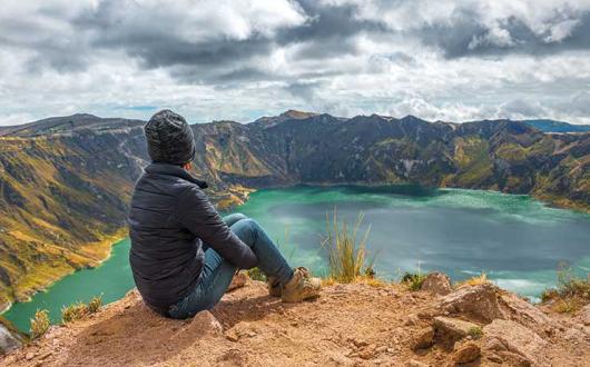 Hiker looking out over a lake