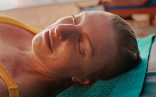 The campaign featured a number of people relaxing on the beach after terrible times