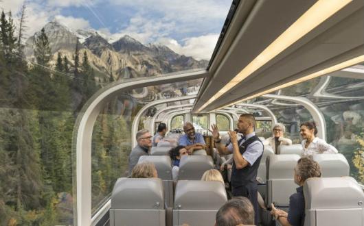 Rocky Mountaineer trains travel through majestic mountain scenery