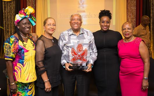 Sir Royston Hopkin pictured receiving an Outstanding Achievement Award in 2019