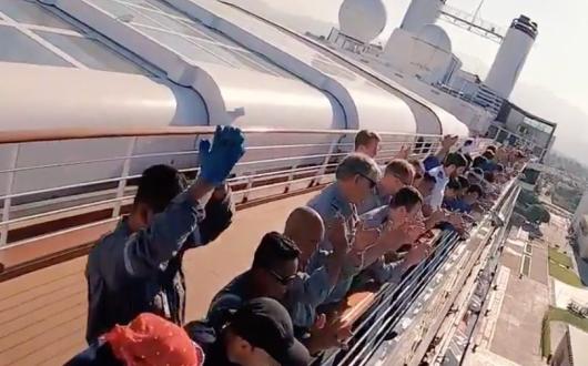 People applauding onboard the MS Rotterdam