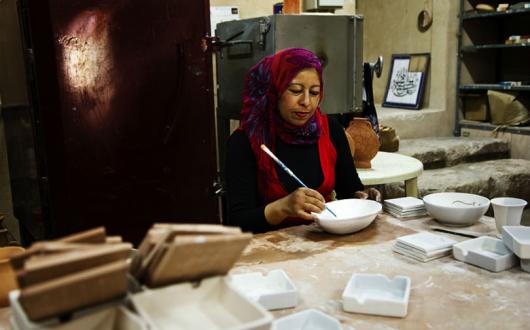 Iraq al Amir woman painting pottery