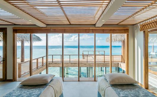 Anantara Kihavah's two-bedroom overwater pool residence's spa treatment room