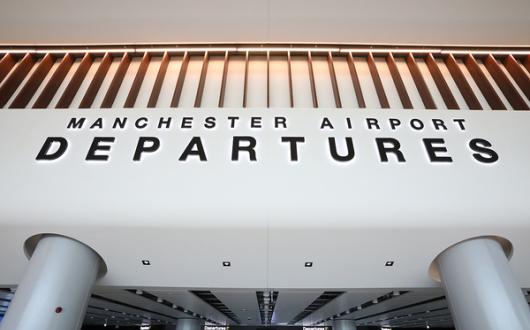 Manchester airport passengers experienced long security delays this summer