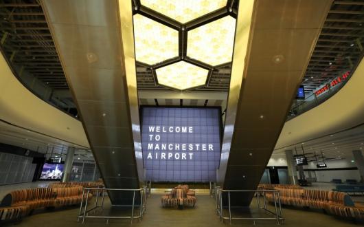 A honeycomb-inspired lighting feature serves as a centrepiece for the terminal (Credit: Manchester Airport)