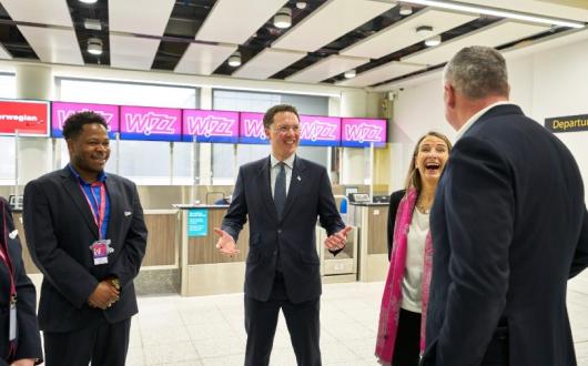 Courts (centre) met with airport and airline staff during his visit
