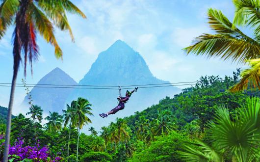 The guide features an array of activities including zip-lining, sailing, surfing, snorkelling, and whale, dolphin and turtle watching