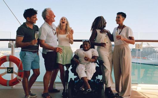 The-group-laugh-together-on-the-deck-of-Celebrity-Apex_MPreview.-Cele.jpg