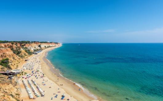 The conference will be held in Olhos de Agua in the Algarve (pictured: Praia da Falesia) (Credit: iStock)