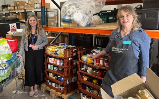 Chair of the Airport Community Network Emma Stone (left) handed over the donations to the Message Community Grocery