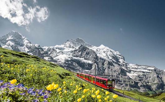 Customers can hop aboard Jungfrau Railways, seen here in front of the Jungfrau summit in the Bernese Oberland (Credit: Switzerland Tourism)