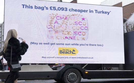 On the Beach ambushes luxury brand event with 'holidays, not handbags!' message