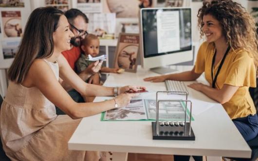Family travel agent travel agency child iStock-1338040171 (Credit: iStock)