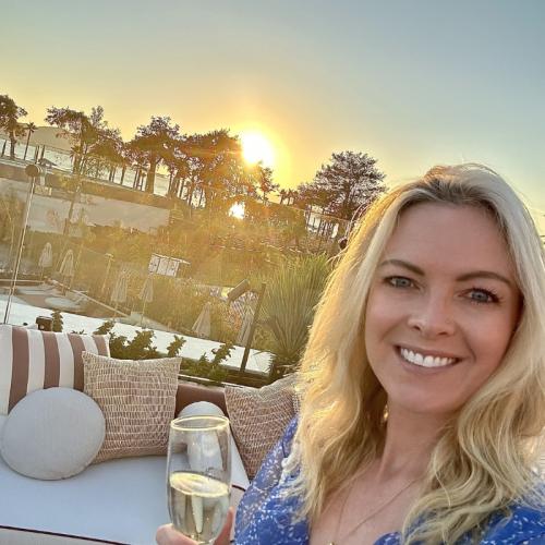 Blonde woman smiling with champagne 