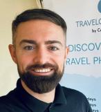 Headshot of Travelosopher travel agent Carl Hogan