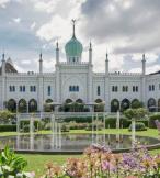 White palace-like hotel with green gardens 