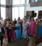 Group of people holding awards 