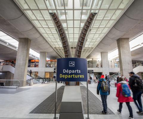 People head to the departure gates at Paris's Charles de Gaulle airport