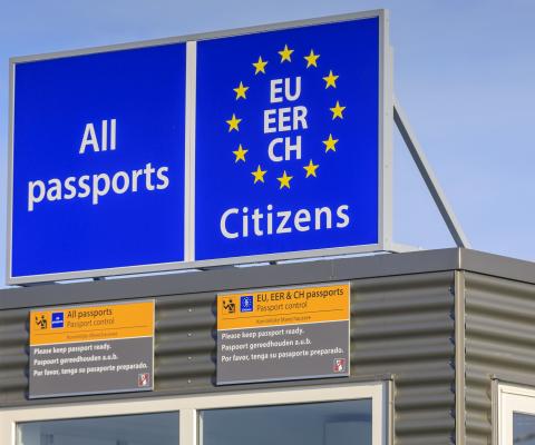 A border control point asking for all passports with the EU stars
