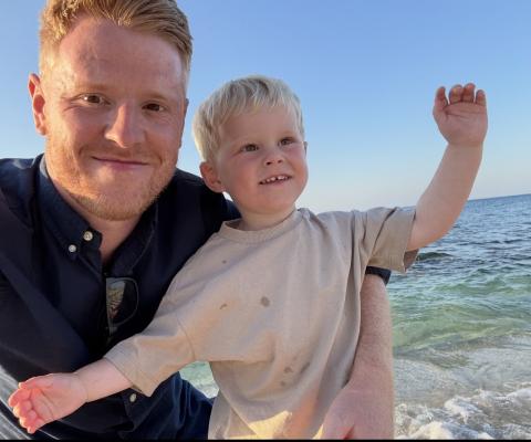 Tom Parry with his two year old son Theo on holiday in Crete