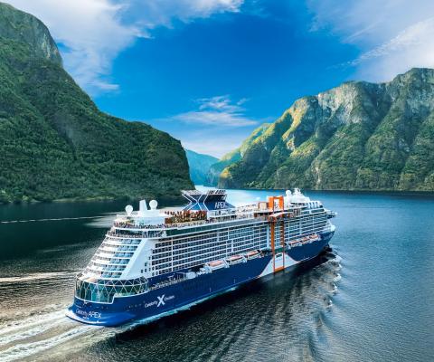 Ship sailing across fjords