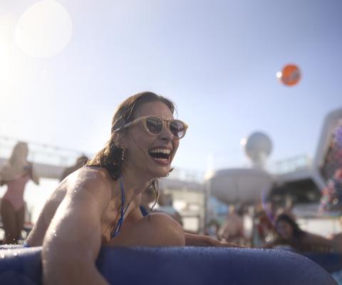 Smiling woman holding inflatable 