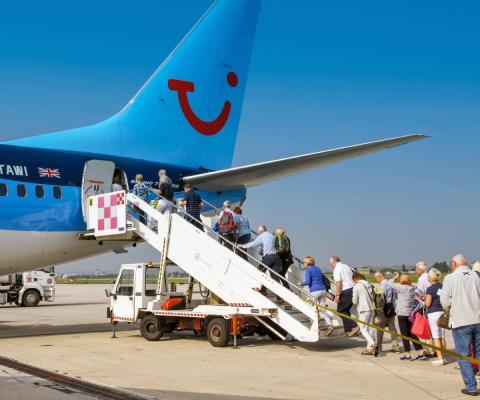 Passengers board a Tui aircraft
