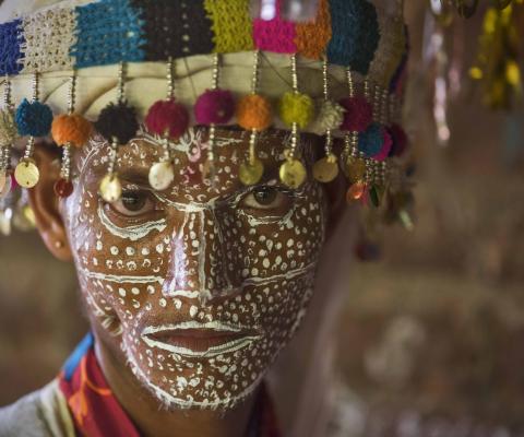 Rathwa tribe member with traditional face painting, curtesy of Gujarat Tourism