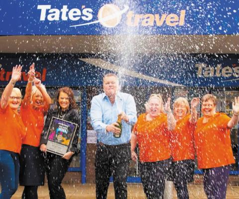 The team at Tates Travel celebrating its acquisition