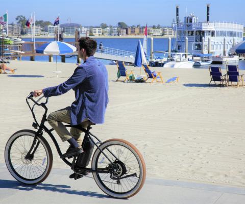 Man cycling on seafront