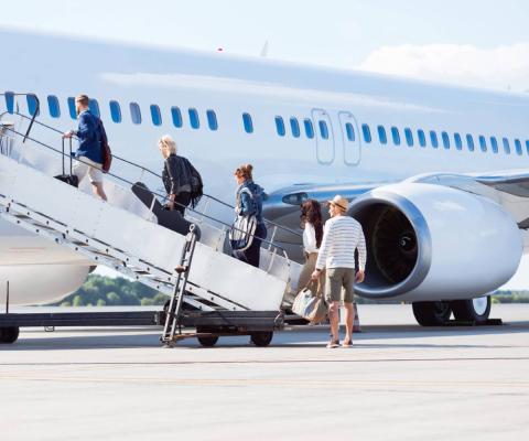 Travellers boarding a plane