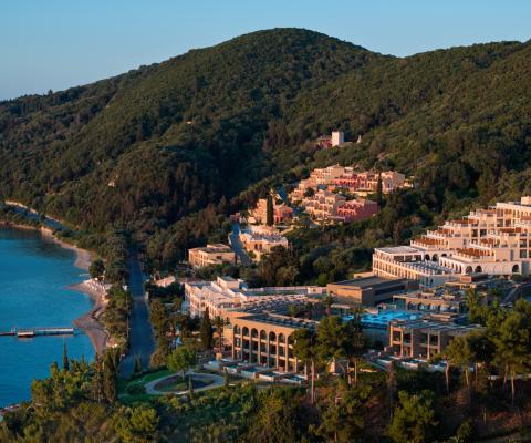 Aerial view of MarBella resort, a hotel sat in a sweeping, tree-covered cove