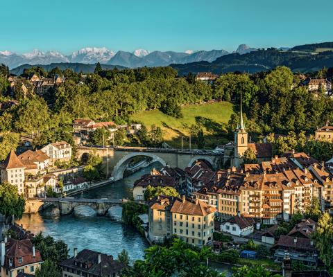 Aerial view of Bern in Switzerland including river, church and surrounding green countryside